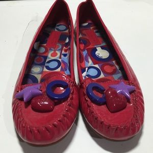 Patent leather cherry red Coach flats