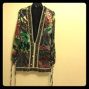 Custom made mini dress with beautiful jewels.