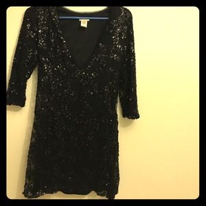 Plunging v neck sequined little black dress.