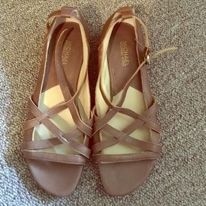 Brown Michael kors slight wedge sandal.
