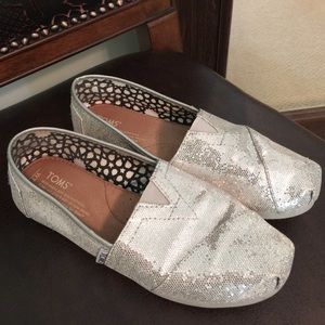 Gently used silver sequin TOMS slip ons