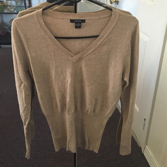 Gorgeous well tan sweater.