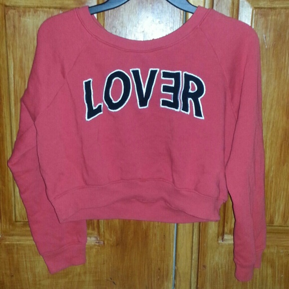 Red w/ black lettering outlined w/ white