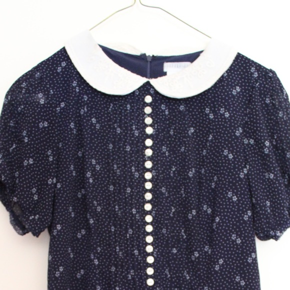 Navy blue polyester romper.