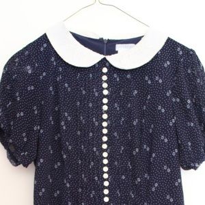 Navy blue polyester romper.