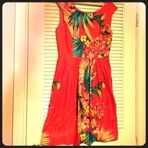 Colorful floral sleeveless tea length dress.