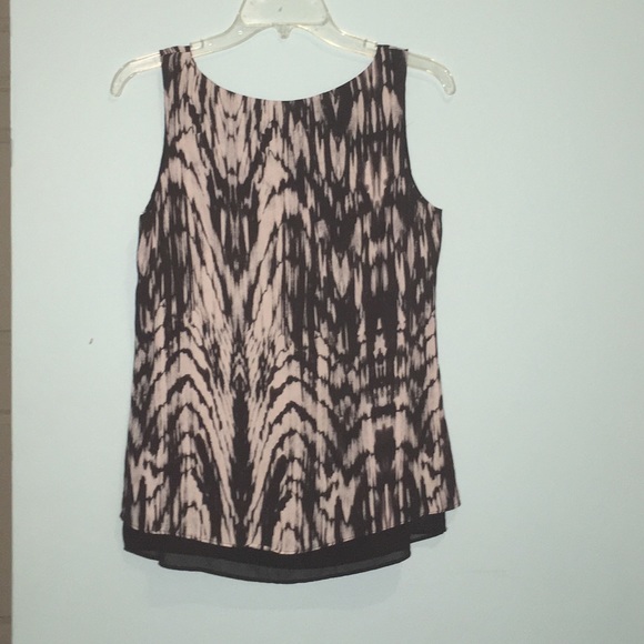 A black and white sleeveless blouse