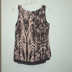 A black and white sleeveless blouse