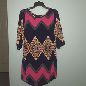 A tribal like print dress, goes right about knee