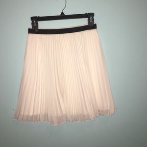 A white skirt that comes down to your knee