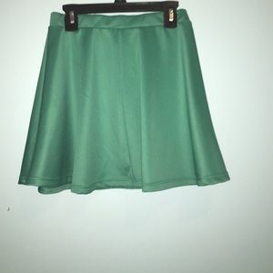 A polyester teal miniskirt