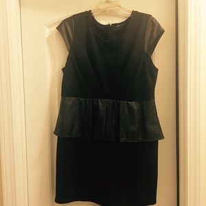 Black fitted mini dress with flair skirt