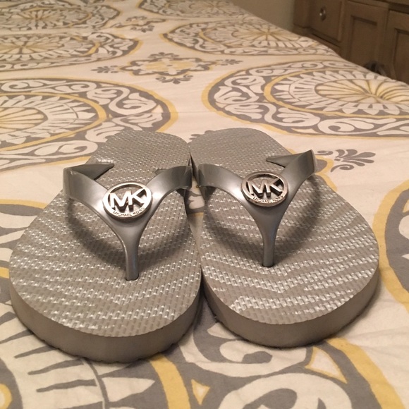 Like new silver Michael Kors flip flops