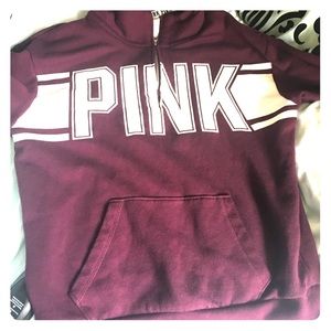 A burgundy pull over PINK jacket