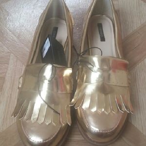 Gold penny loafers
