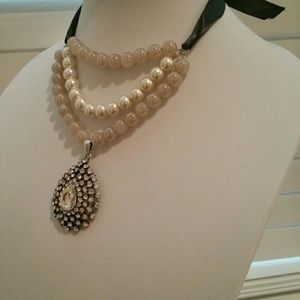 Beaded necklace with charm