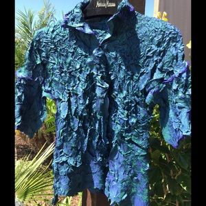 Issey Miyaki crinkle shirt.