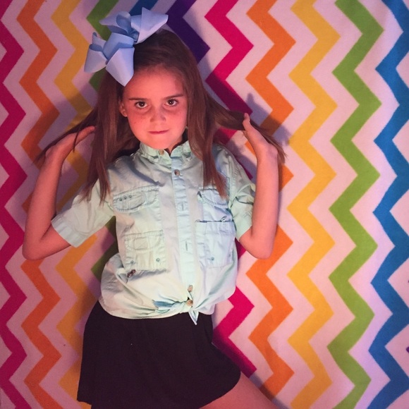 A turquoise Columbia fishing shirt.