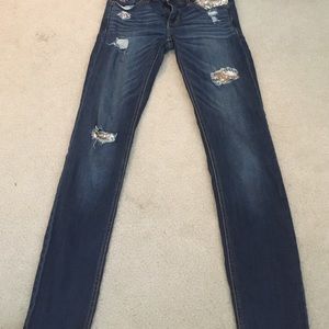 Ripped gold jeans.