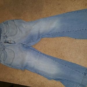 Plain worn down flared jeans.