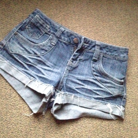 Jean shorts. Design on its back pockets.