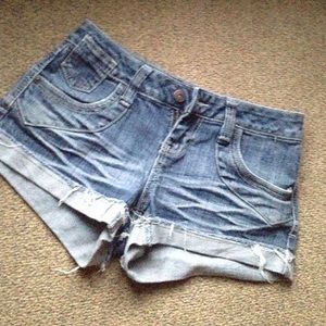 Jean shorts. Design on its back pockets.