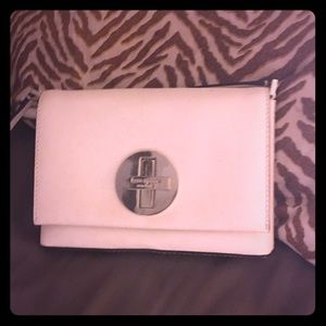 Cream colored Kate Spade crossbody handbag