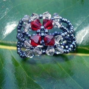 Red and navy blue beaded ring