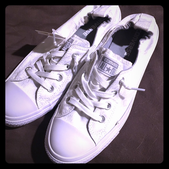 NWT Women's white slip on Converse shoes.