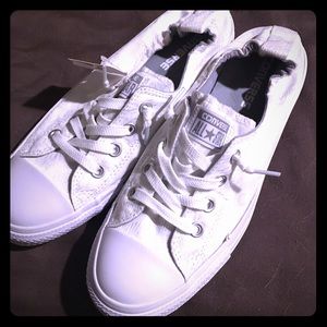 NWT Women's white slip on Converse shoes.