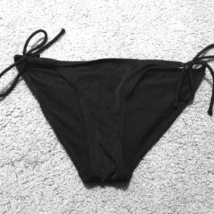 Cheeky black bathing suit bottoms