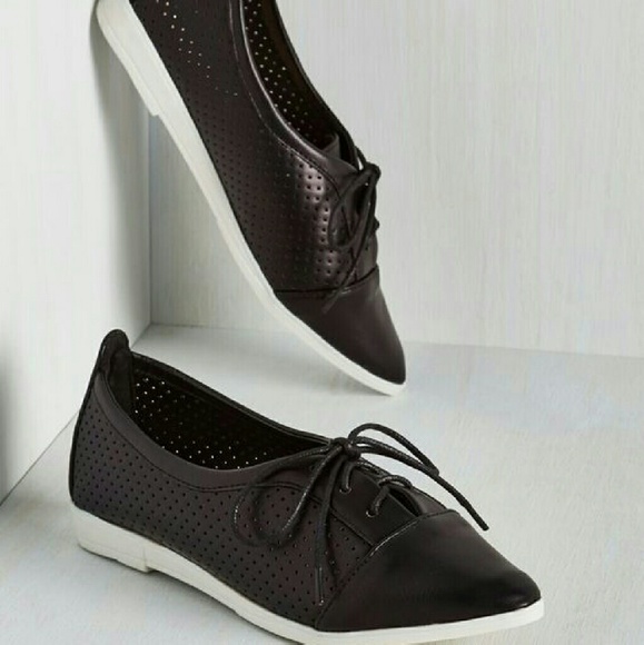 Black and white lace up shoes