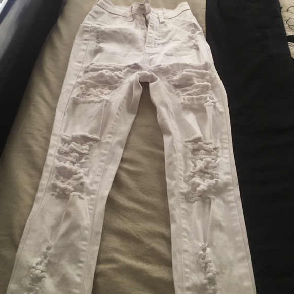 Jeans ripped holes, worn once, too little for me