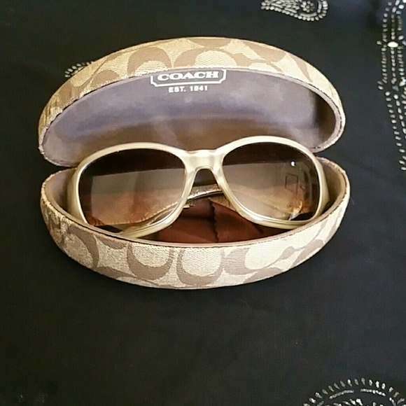 New Coach sunglasses with matching box.