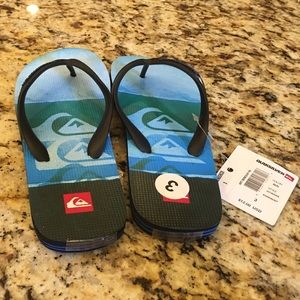 Pair of quicksilver flip flops size 3
