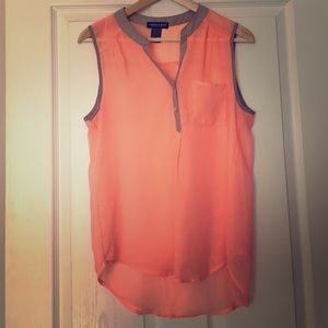 Sheer coral top with grey accent collar