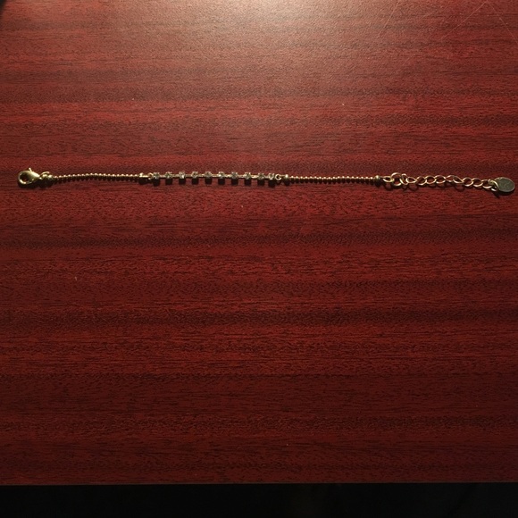 Thin silver bracelet with silver stones