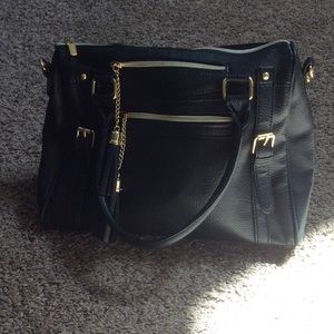 Black shoulder bag with gold accent/tassel