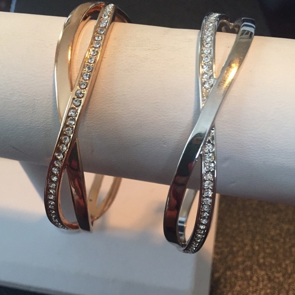 Set of two bracelets. One gold and one silver.