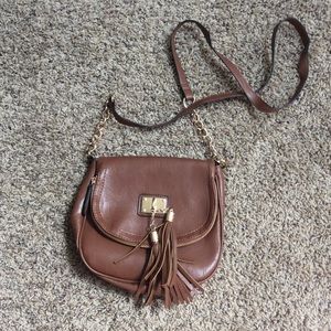 Tan crossbody with chain accents on strap