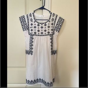 Embroidered white linen dress