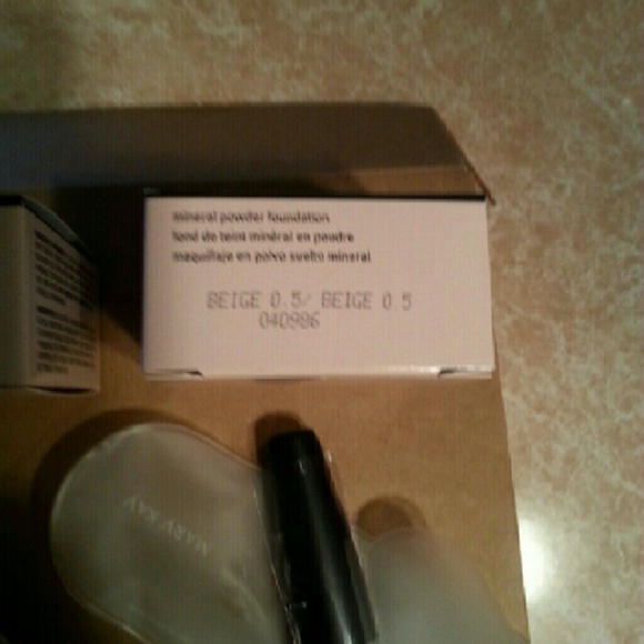Mary Kay Foundation and brush