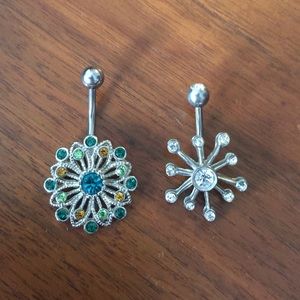 Two pendant-style belly button rings