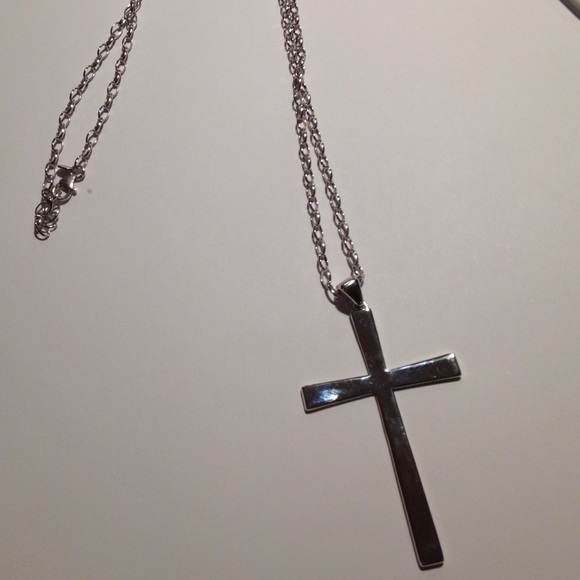 White bronze cross necklace.