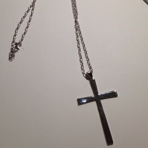 White bronze cross necklace.