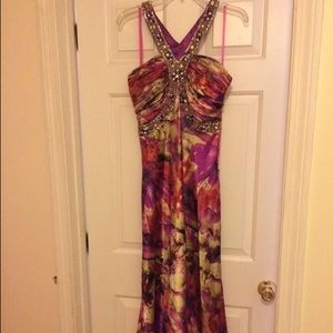 Two prom dresses that have only been worn once.