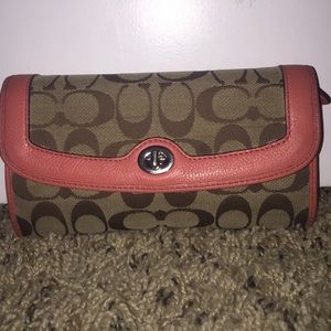 Peach color lined Coach wallet