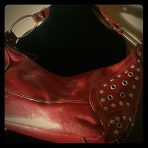 Red studded shoulder bag