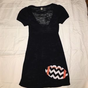 Sheer black dress with football.