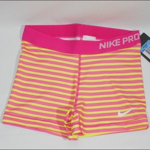 Pink yellow striped Nike pro shorts